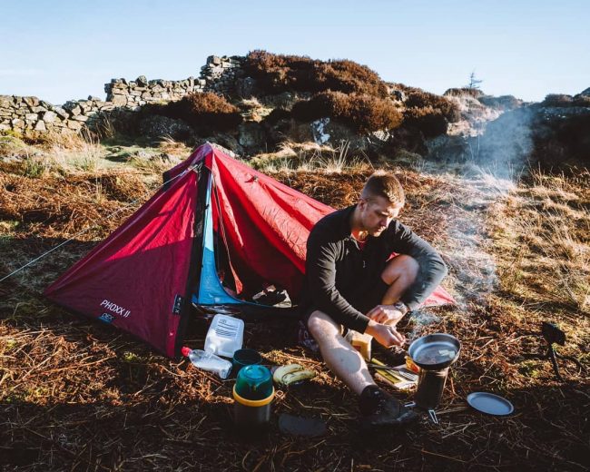 Harrison Ward cooking on Side Pike after a wild camp - Photo by Daniel J Toal