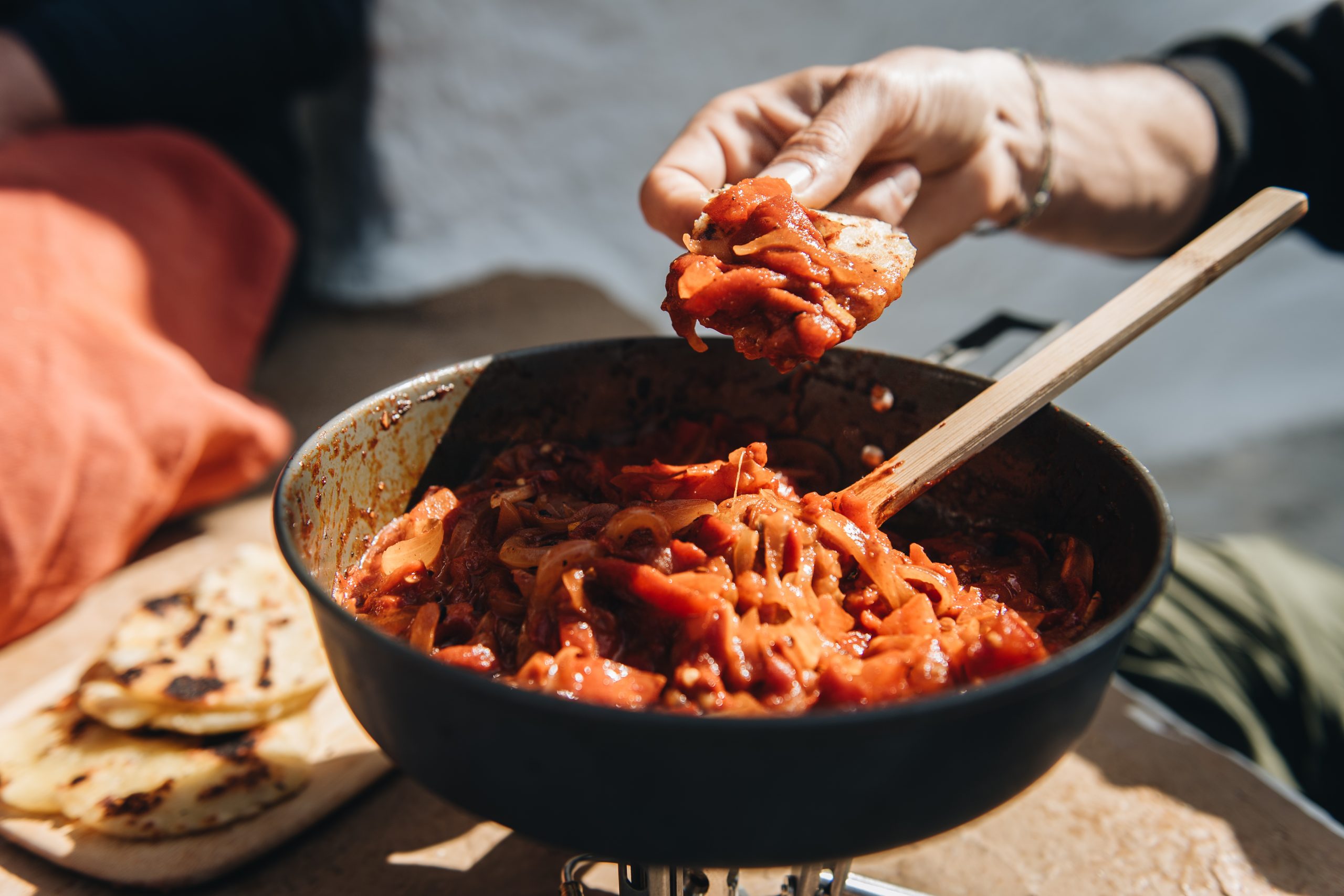 Andalusian dried red pepper, tomato and onion stew with fresh flatbread